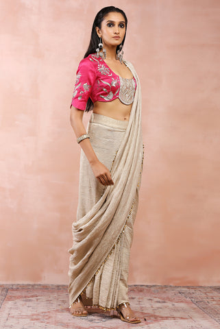 Hot pink embroidered choli with silver organza crushed tissue saree.