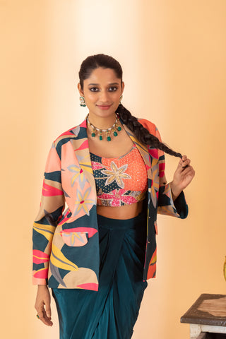 A multi color embroidered jacket set paired with bustier and drape skirt