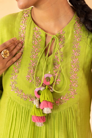 A lime green hand embroidered one piece dress