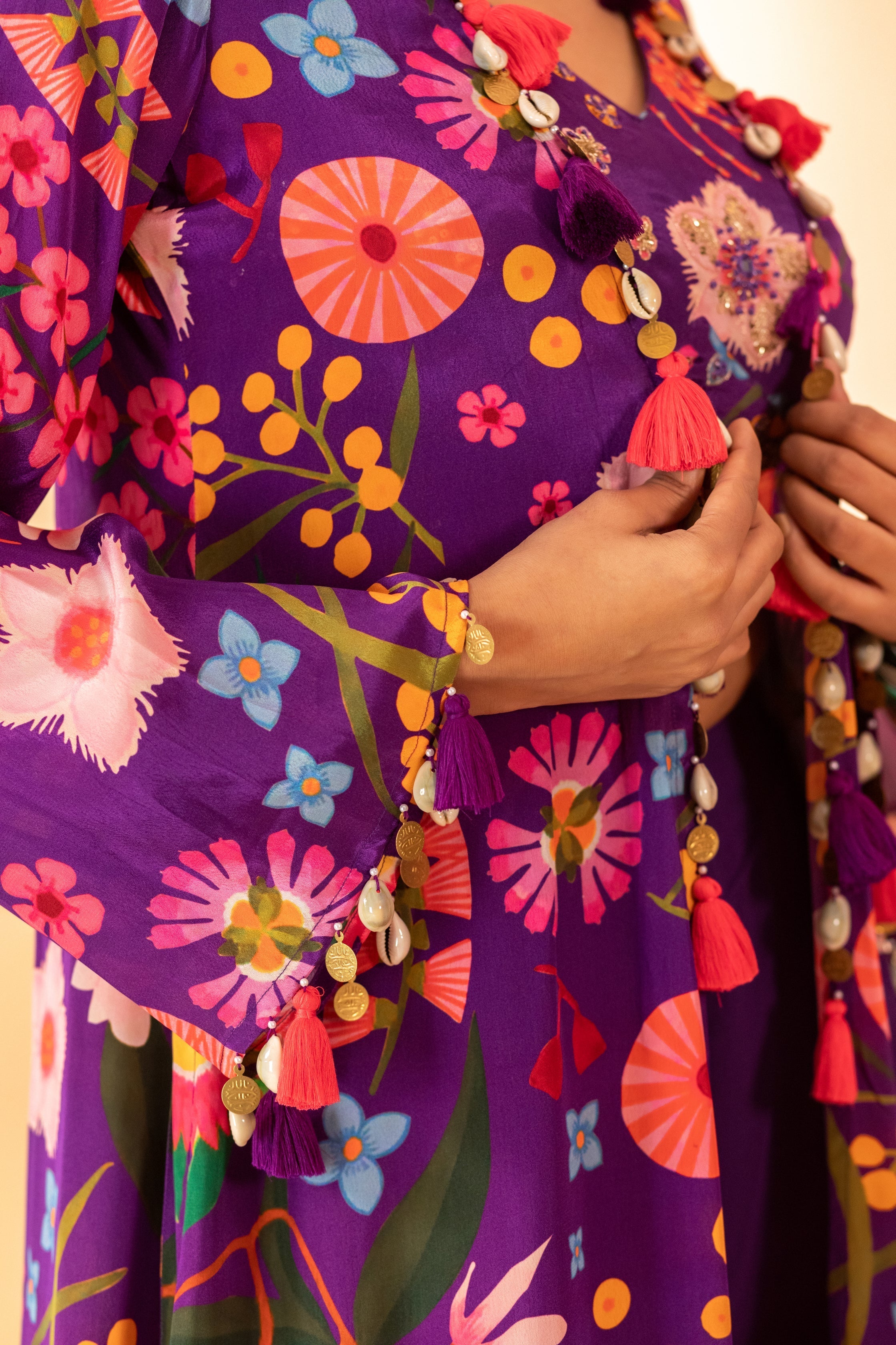 A floral printed jacket set paired with bustier and plazzo pants