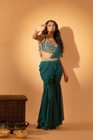 A pre-draped saree set paired with hand embroidered blouse and belt