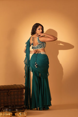 A pre-draped saree set paired with hand embroidered blouse and belt