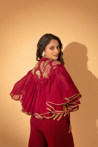 A jumpsuit with embroidered cape