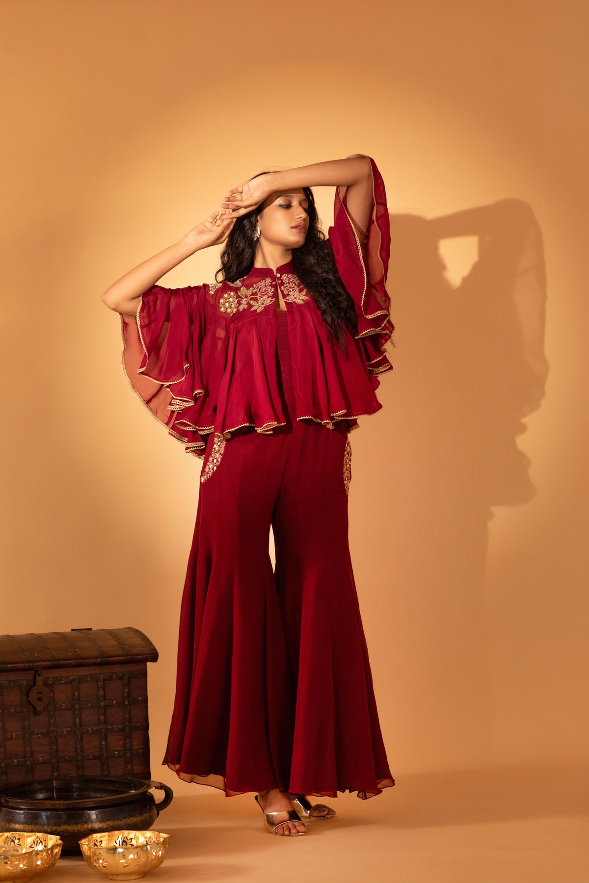 A jumpsuit with embroidered cape