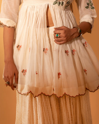 A skirt set with embroidered peplum and duptta