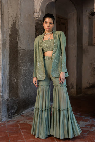 A embroidered blazer set with bustier and sharara pants