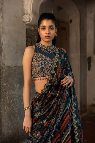 A teal blue skirt saree with hand embroidered blouse