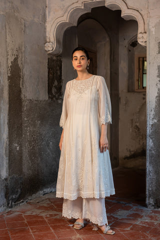 A hand embroidered kurta set with pants