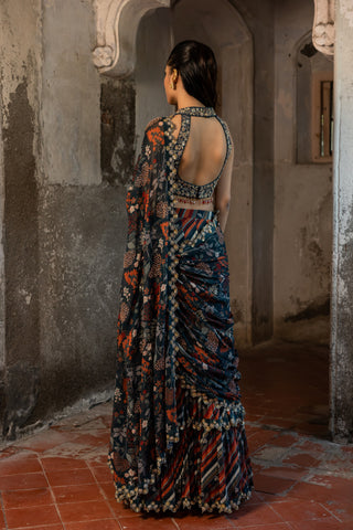 A teal blue skirt saree with hand embroidered blouse