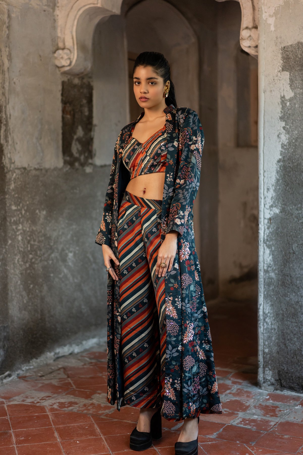 A hand embroidered jacket set paired with bustier and pants