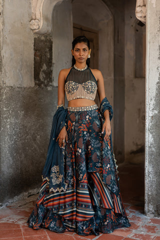 A printed teal blue lehenga with hand embroidered blouse and duptta