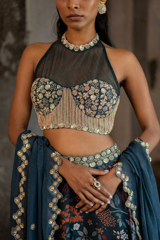 A printed teal blue lehenga with hand embroidered blouse and duptta