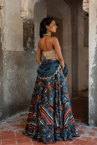 A printed teal blue lehenga with hand embroidered blouse and duptta