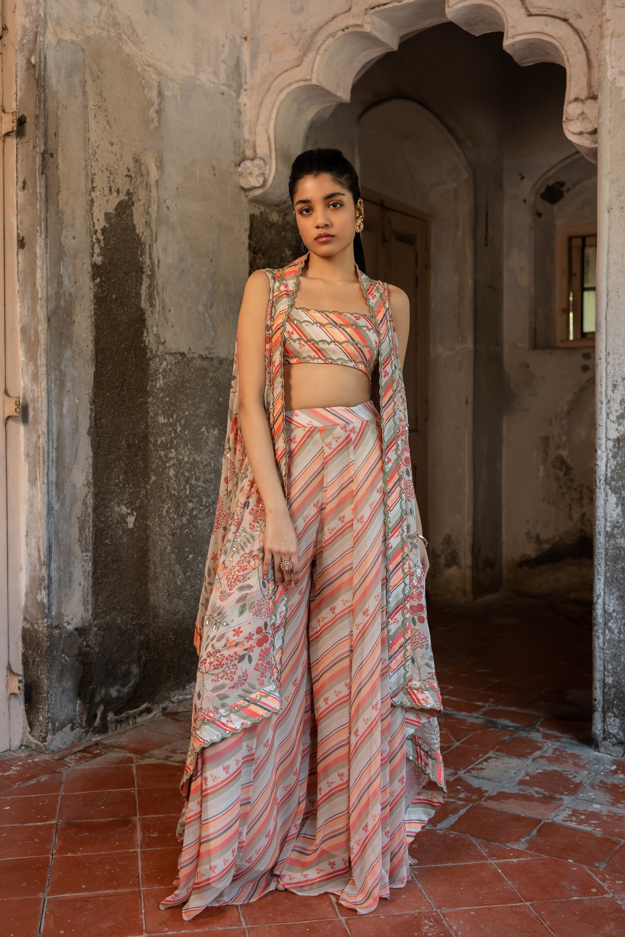 A hand embroidered cape set paired with tube and pants.