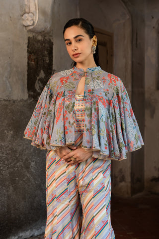 A jumpsuit paired with hand embroired cape