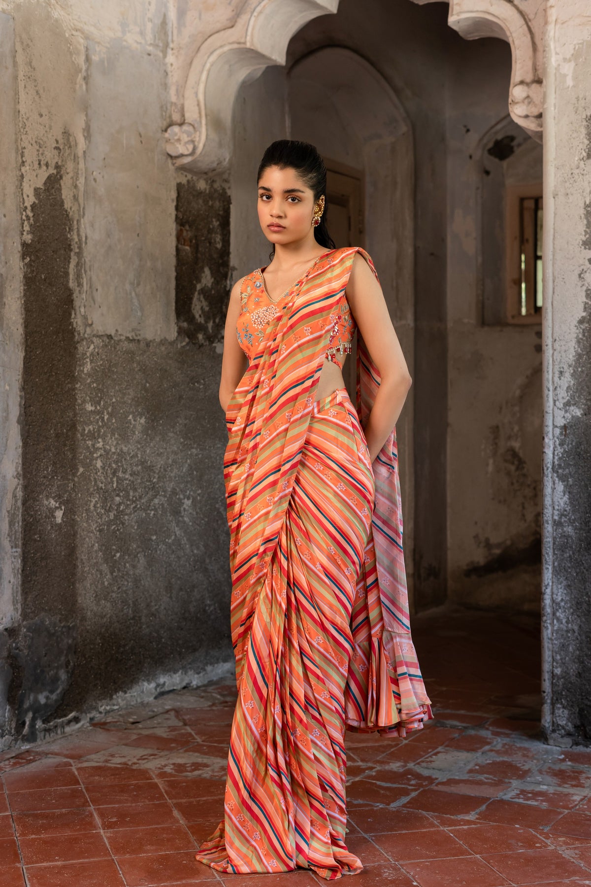 A pre-draped saree set with hand embroidered blouse