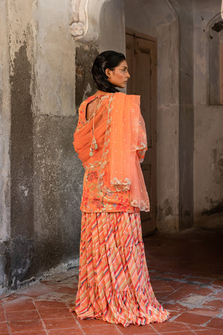 A sweetheart neckline kurti paired with layred skirt and duptta