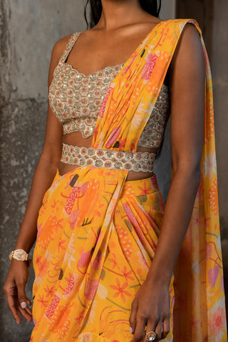 A pre-draped layer saree with hand embroidered blouse and belt