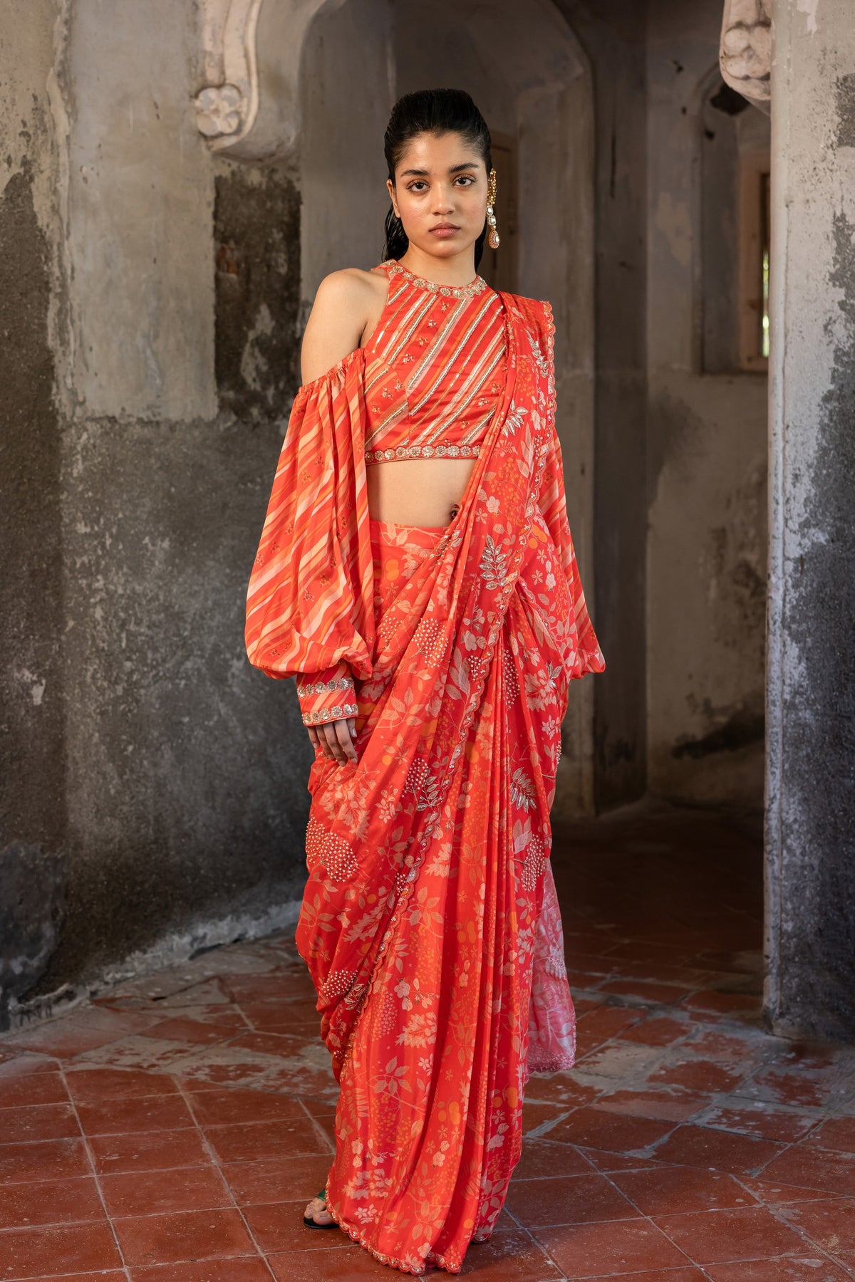 A pre-draped saree set with hand embroidered blouse