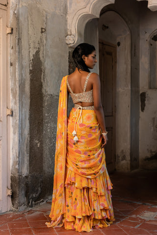 A pre-draped layer saree with hand embroidered blouse and belt