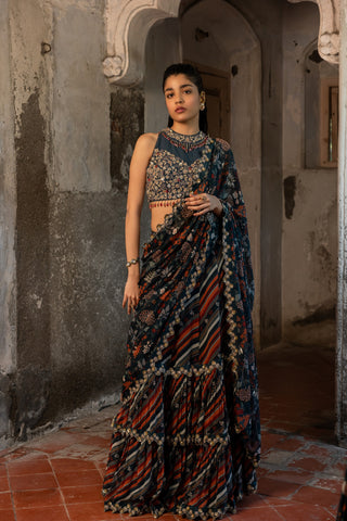 A teal blue skirt saree with hand embroidered blouse