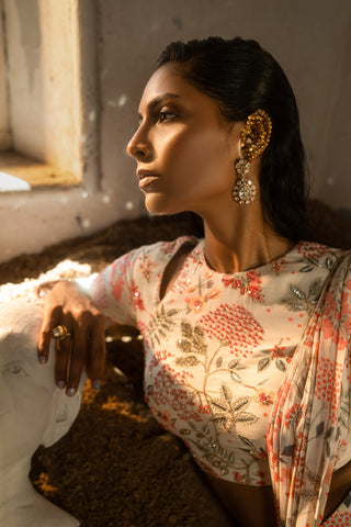 Ivory printed ruffle saree with hand embellished blouse