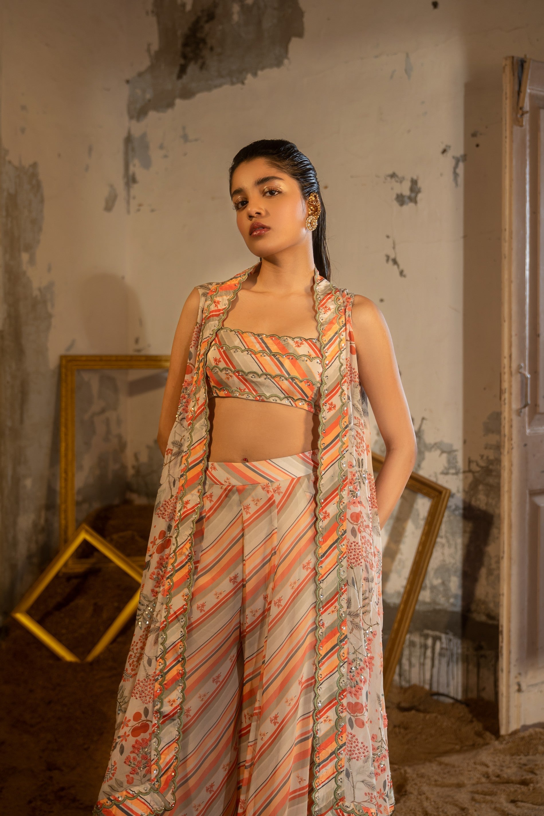 A hand embroidered cape set paired with tube and pants.