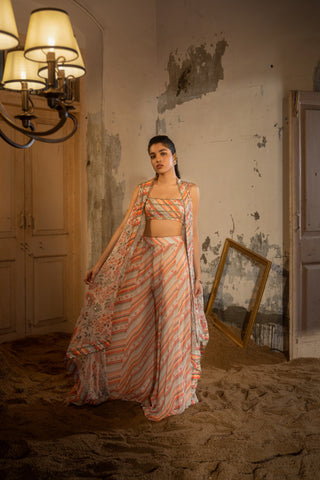 A hand embroidered cape set paired with tube and pants.