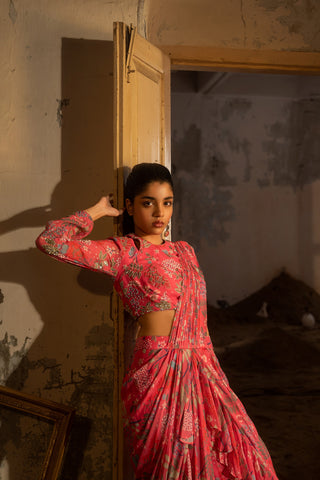 A hand embroidered pre-draped ruffle saree and blouse