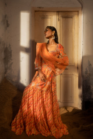 A sweetheart neckline kurti paired with layred skirt and duptta