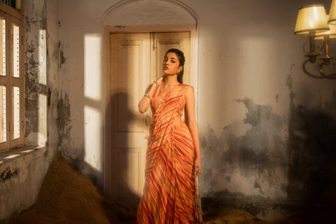 A pre-draped saree set with hand embroidered blouse