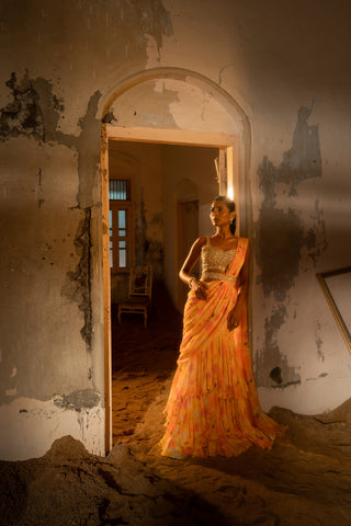 A pre-draped layer saree with hand embroidered blouse and belt