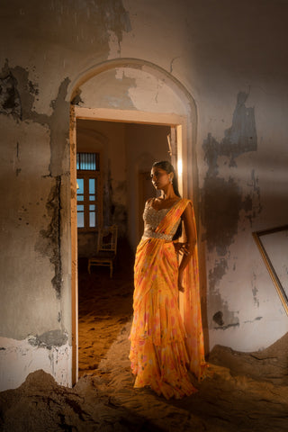 A pre-draped layer saree with hand embroidered blouse and belt