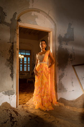 A pre-draped layer saree with hand embroidered blouse and belt