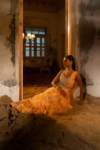 A pre-draped layer saree with hand embroidered blouse and belt