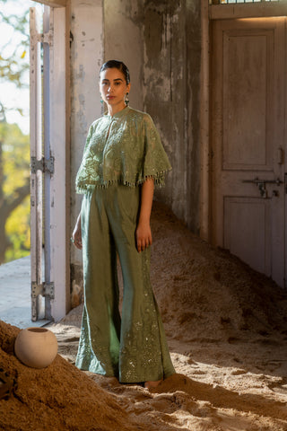 A pista green cape with side cut pant and bustier