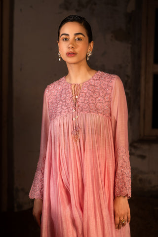 A baby pink kurta set with pants