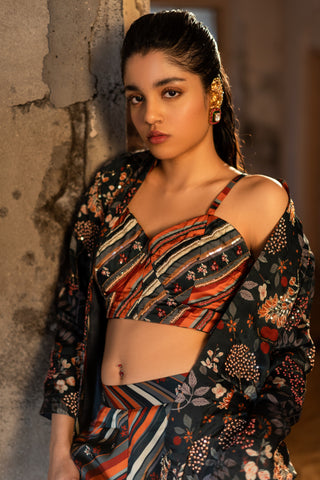 A hand embroidered jacket set paired with bustier and pants