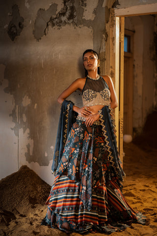 A printed teal blue lehenga with hand embroidered blouse and duptta